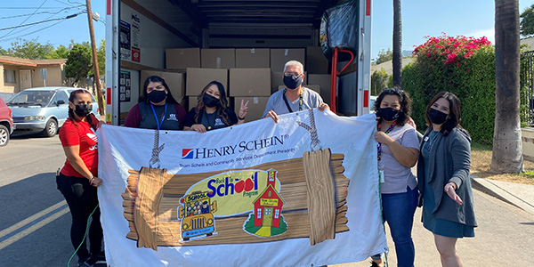 Team Schein Provides Backpacks, School Supplies, and More